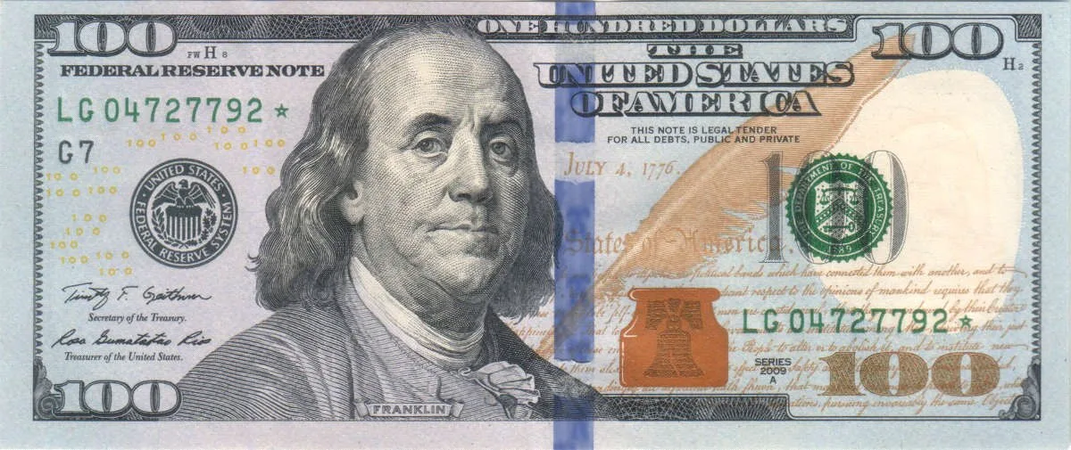 Obverse of the US 100 dollar bill showing Benjamin Franklin and the blue security ribbon